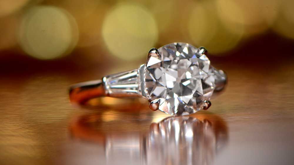 Engagement Ring with Platinum and Gold on Table