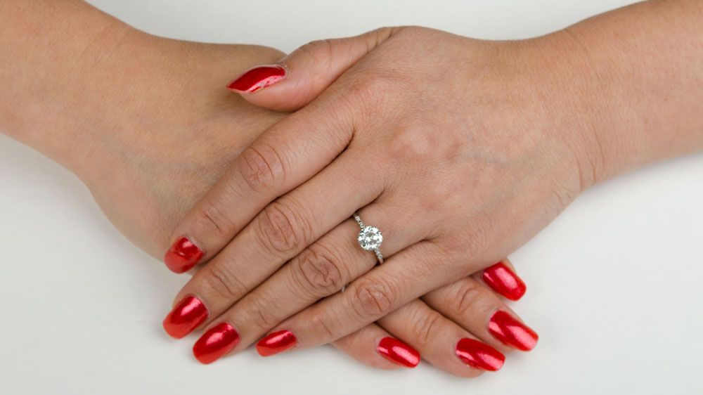 Diamond Engagement Ring on Finger
