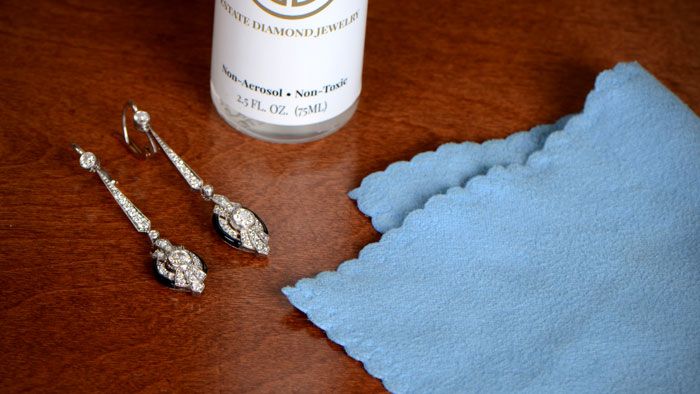 drop earrings with cleaning cloth and non toxic cleaning chemical