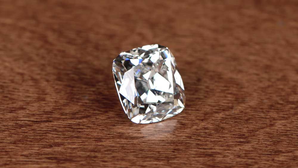 Big Cushion Cut Diamond on Table Surface