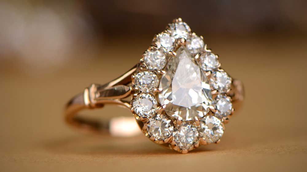 Engagement Ring with Antique Stones in Halo