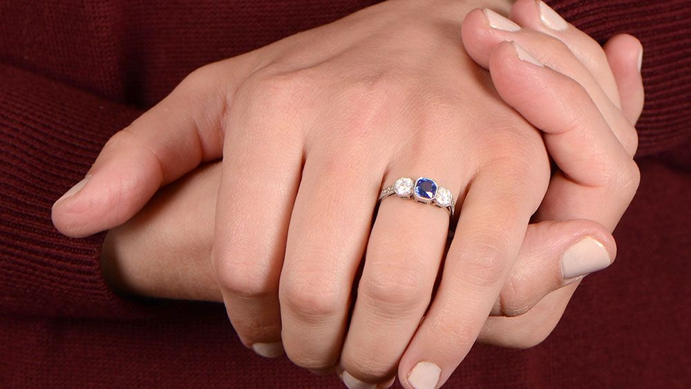 Diamond and Sapphire Wedding Ring on Fingers with Smaller Diamonds
