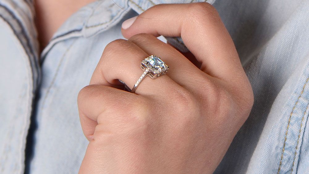Aquamarine Engagement Ring fitting tightly on finger