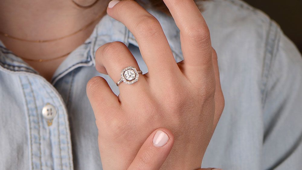 Woman With Diamond Halo Engagement Ring On