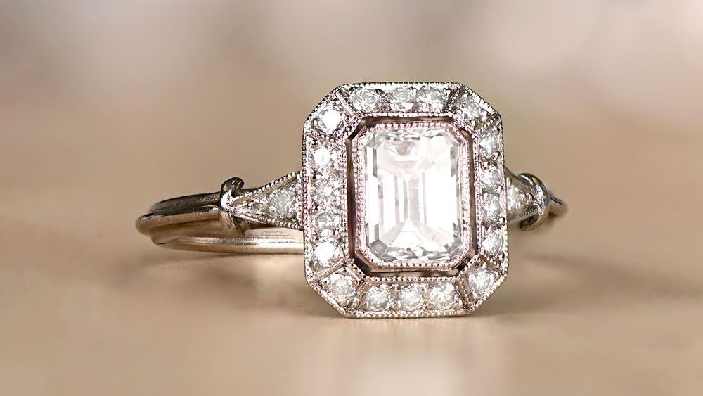Ring With Emerald Cut Diamond And Diamond Halo