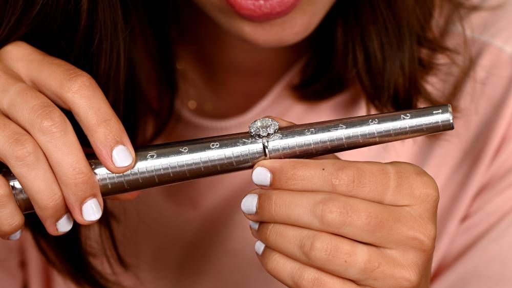 Measuring Diamond Ring on Mandrill in Showroom Customer