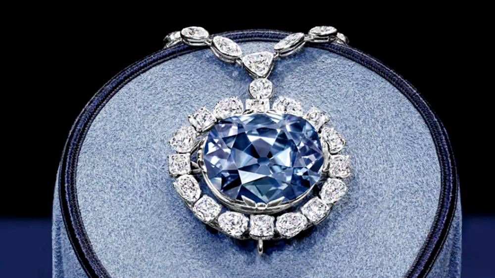 Necklace with hope diamond surrounded by diamond halo