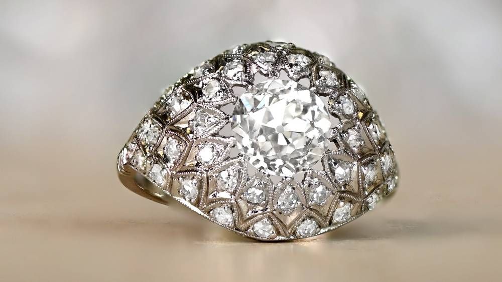 Dome Shaped Bohemia Engagement Ring Featuring Diamond Clusters