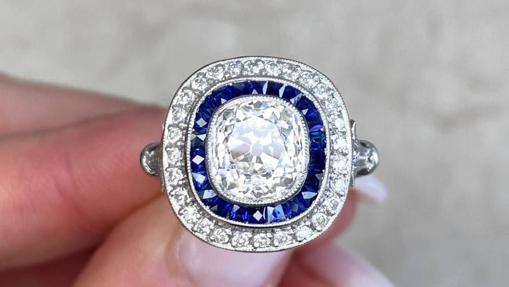 Diamond Ring With A Diamond Halo Following A Sapphire Halo