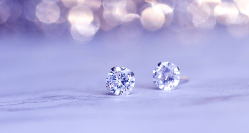 Diamonds Studs on Blue Abstract Background