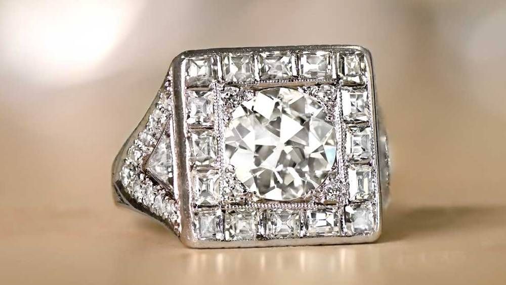 Ring With Round Center Diamond And Square Diamond Halo
