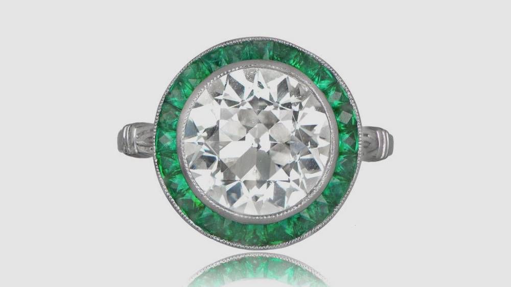 Platinum Engagement Ring With Emerald Halo And Diamond
