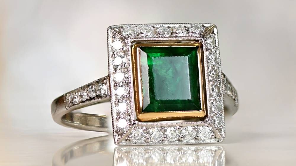 Tolu Emerald Engagement Ring Featuring A Diamond Halo