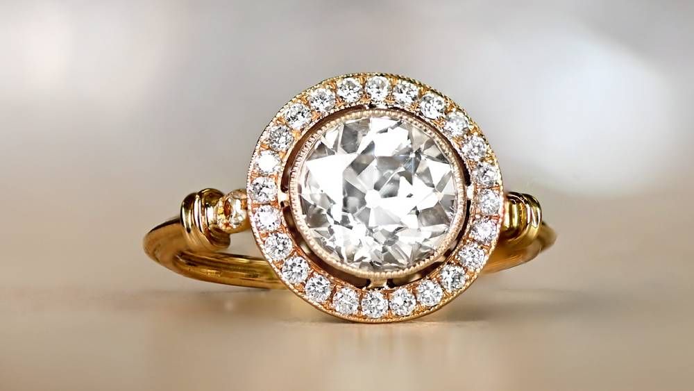 Yellow Gold Diamond Ring Featuring A Diamond Halo
