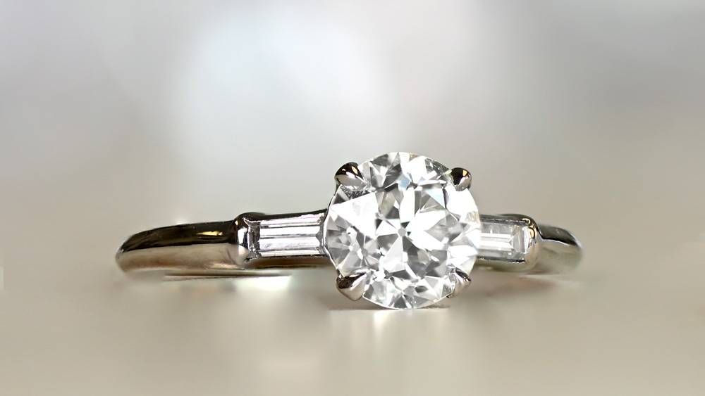 Delicate Diamond Engagement Ring With Two Side Diamonds