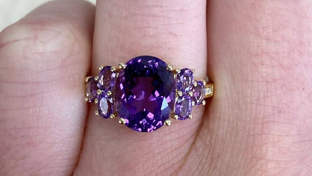 Oval Amethyst Engagement Ring Featuring Yellow Gold And Diamonds