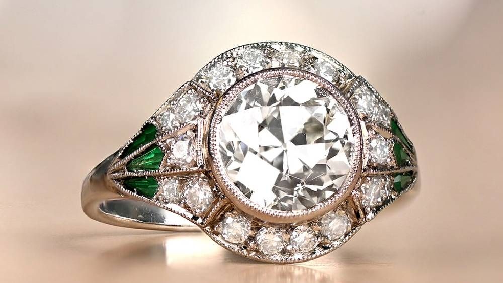 Rounded Diamond Ring With Diamond Halo And Emeralds