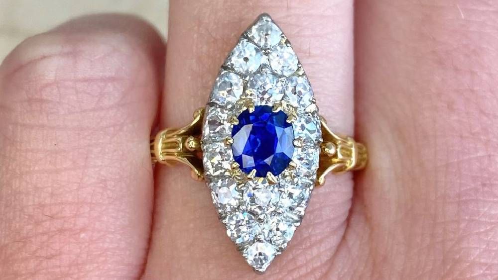 Antique Neston Ring Featuring Center Sapphire And Diamonds