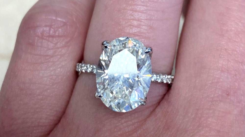 Dainty Ring With Large Oval Diamond And Adorned Shoulders
