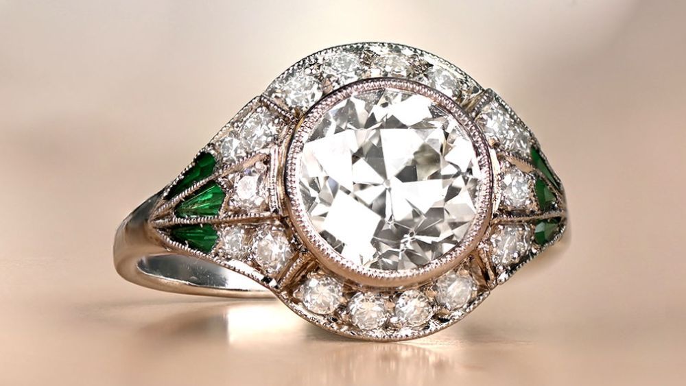 Rounded Diamond Ring With Diamond Halo And Emerald Accents