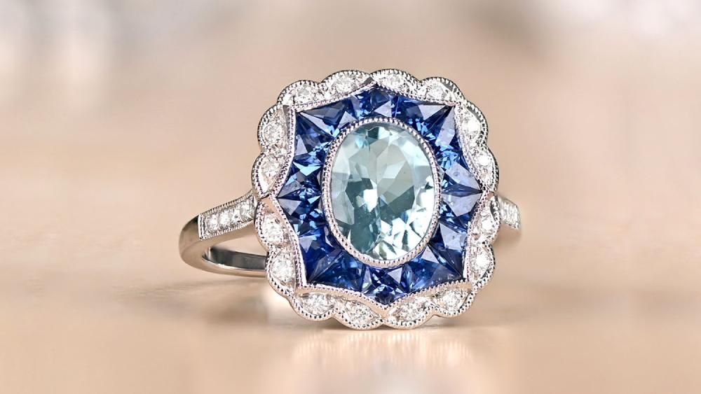 Aquamarine Ring With Uniquely Shaped Sapphire And Diamond Halos