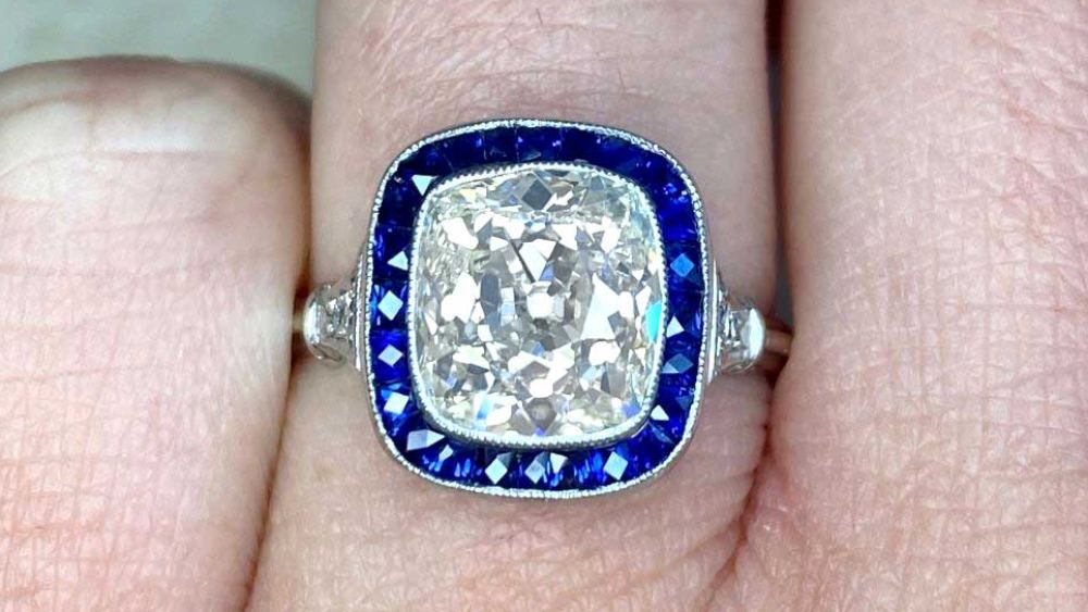 Estate diamond jewelry Montreal sapphire halo engagement ring