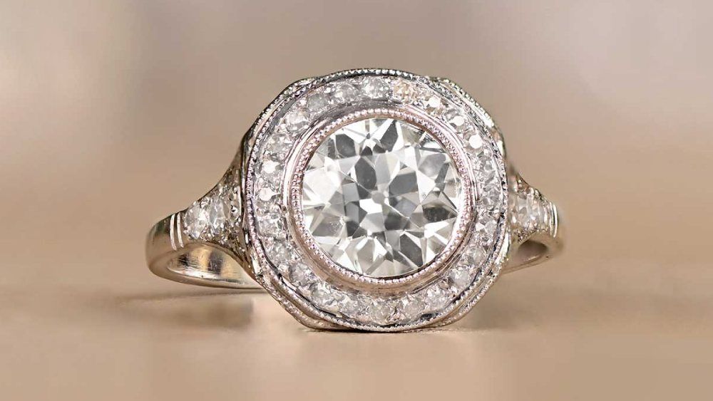 Circular Diamond Ring With Halo Of Small Diamonds 