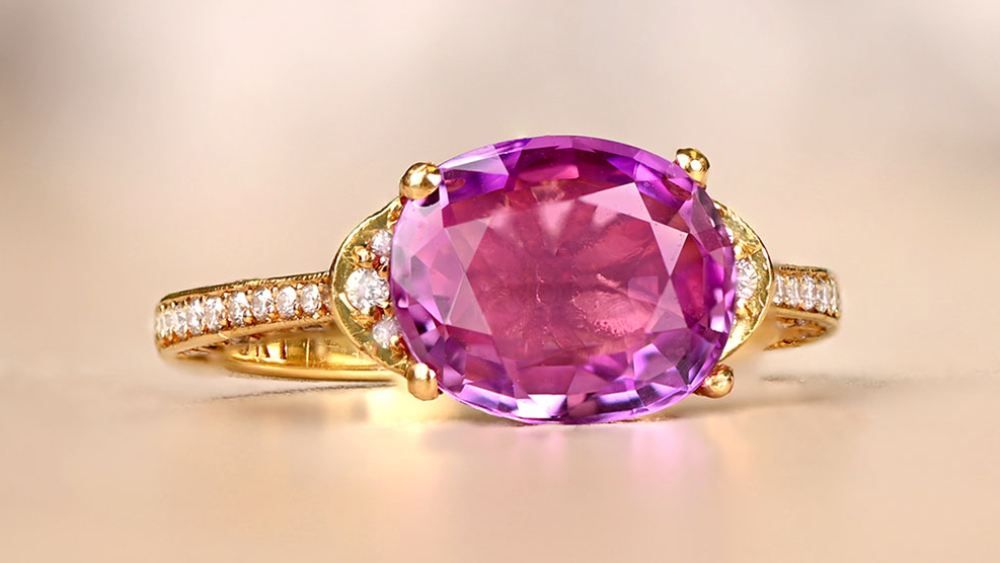 Yellow Gold Engagement Ring Featuring Oval PInk Sapphire