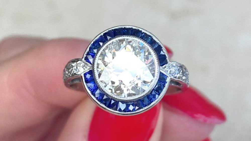 Regal Diamond Engagement Ring With A Sapphire Halo