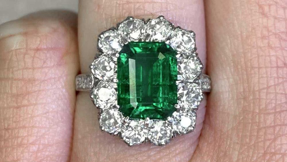 Reed Emerald Engagement Ring With A Diamond Cluster