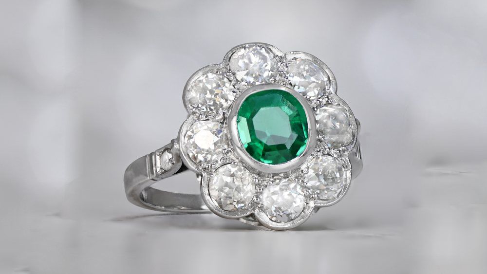 Verdant Edwardian Era Diamond Cluster Ring Featuring Emerald