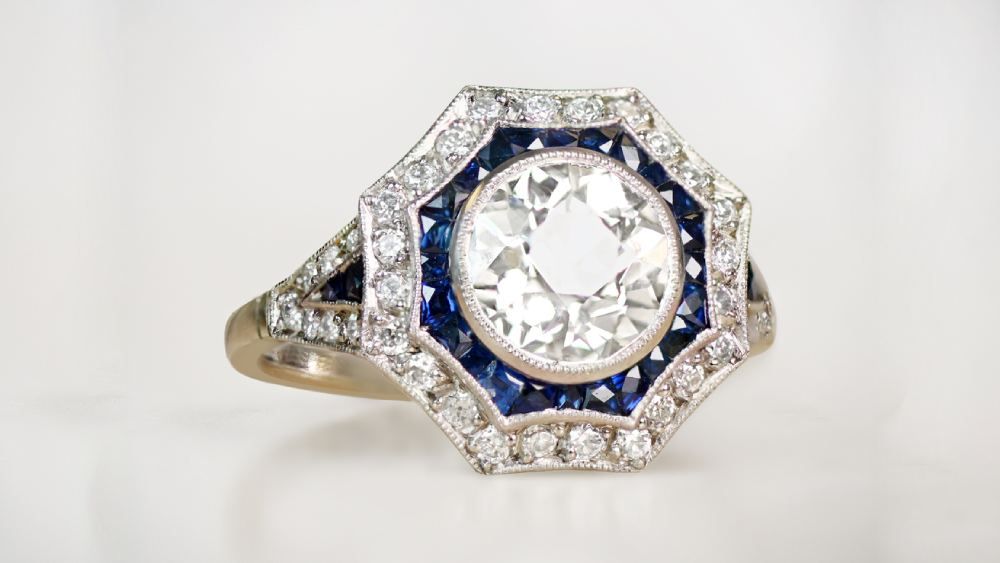 Sunburst Shaped Double Halo Engagement Ring Featuring Diamonds And Sapphires