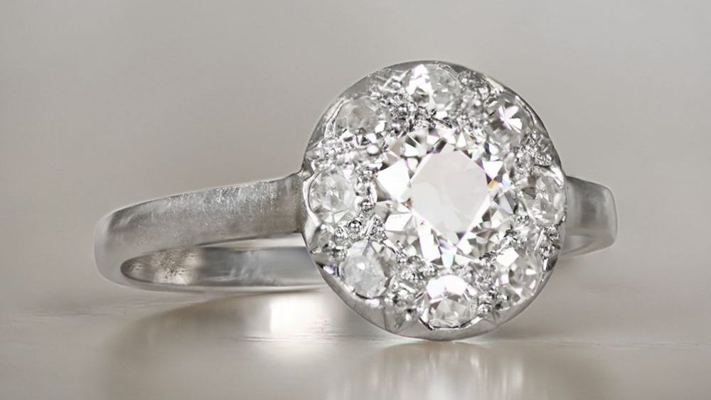 Minimalistic Round Platinum Diamond Ring Featuring Diamond Halo