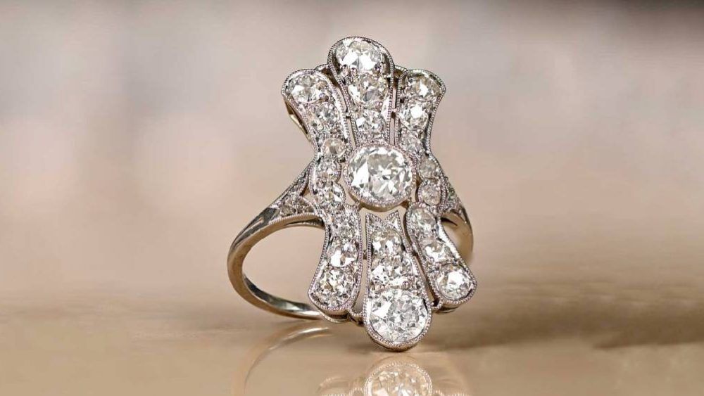 Elongated Diamond Ring Featuring Diamond Adorned Plumes
