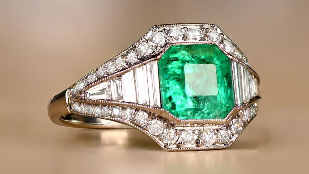 Emerald Engagement Ring With Surrounding Diamond Accents
