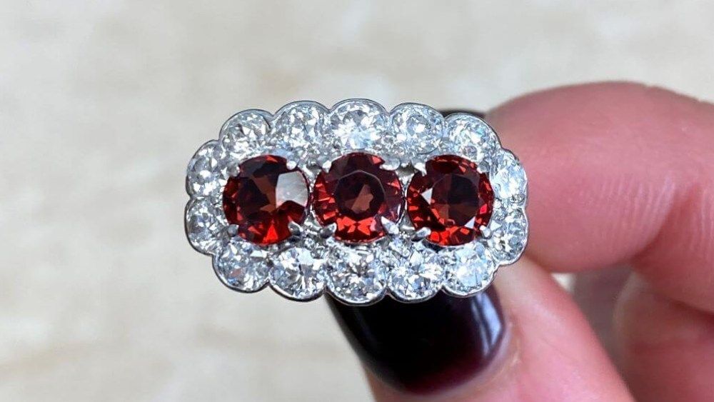 Three Stone Ruby Ring With Diamond Cluster