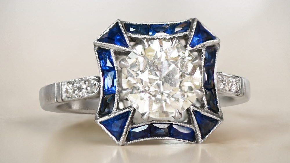 Diamond Ring With Uniquely Shaped Sapphire Halo
