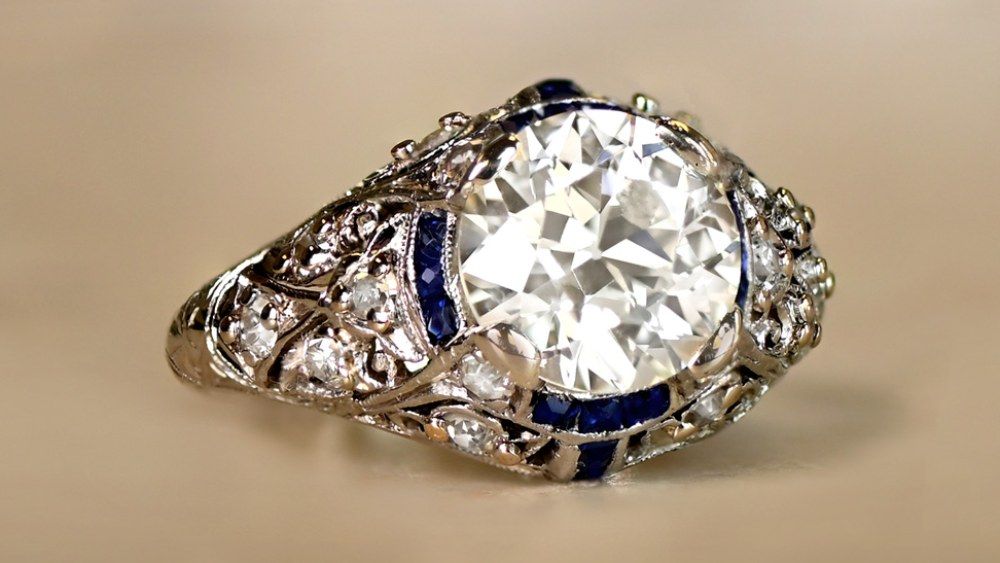 Diamond Ring With Openwork Embellishments And Sapphire Halo