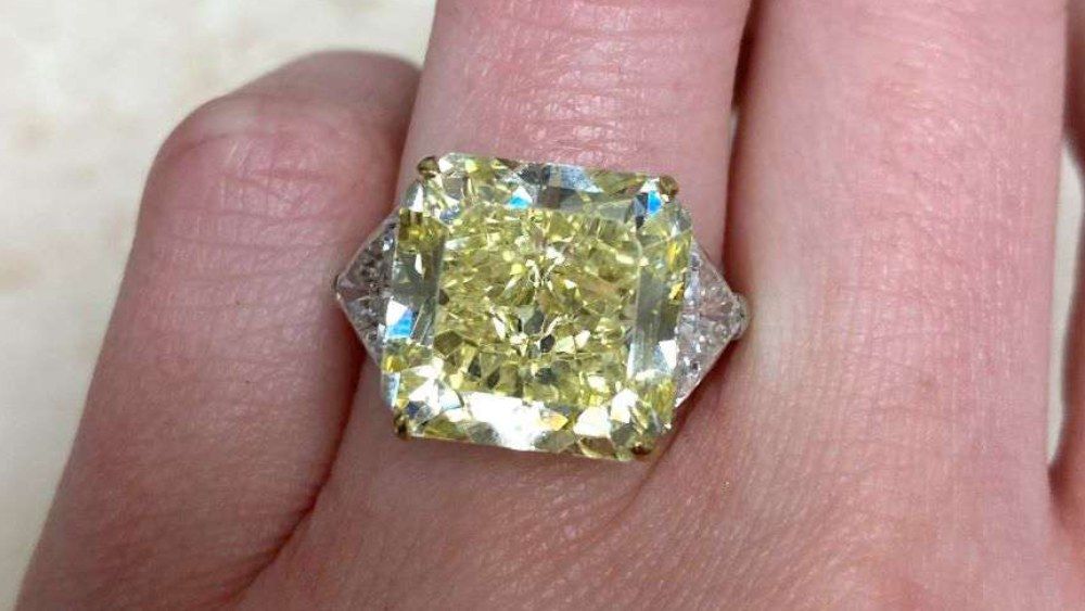 Ring With Yellow Diamond And Triangular Shoulders