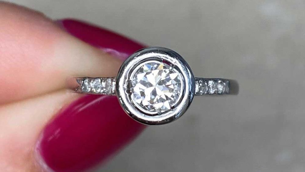 Small Round Diamond Ring With Adorned Shoulders