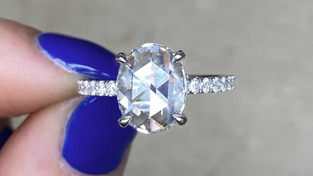 Delicate Ring With Large Diamond And Many Smaller Diamonds