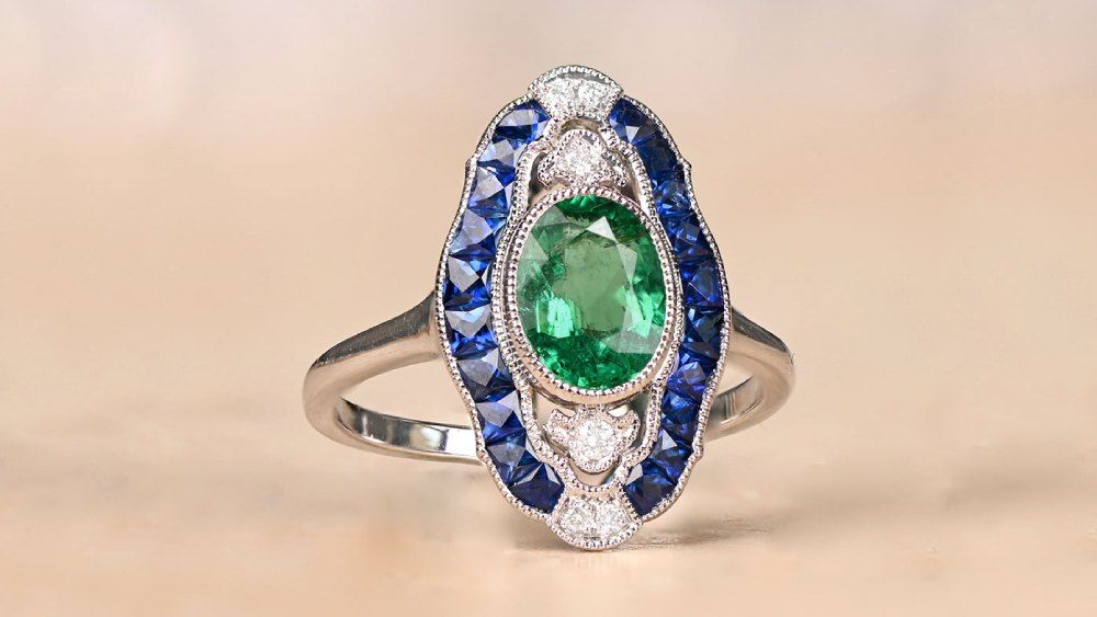 Oval Cut Emerald Ring Featuring Diamonds And Sapphires 