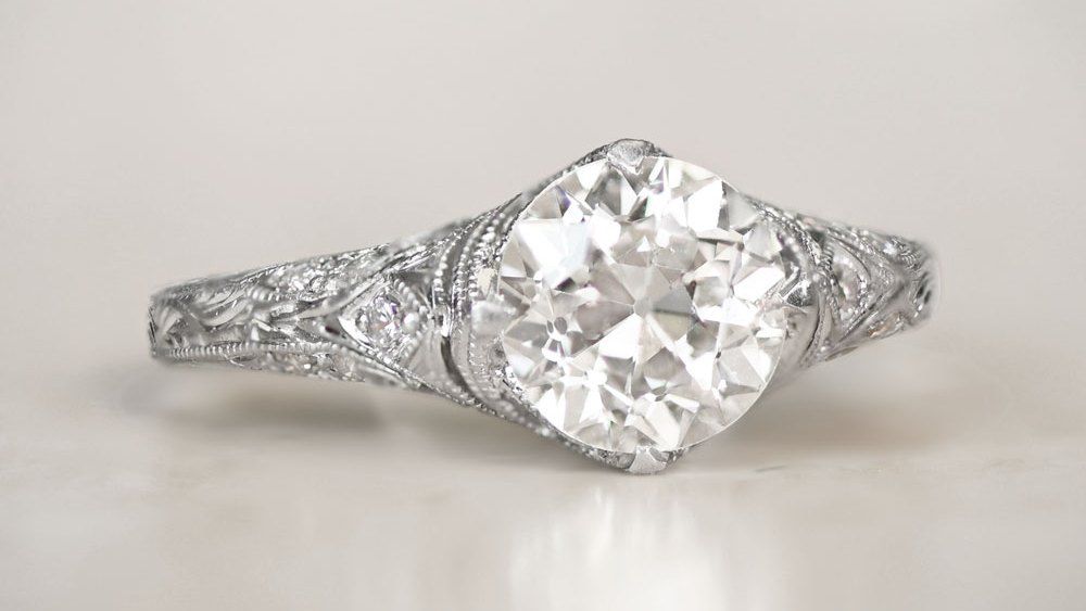 Platinum Engagement Ring Featuring A Diamond And Engravings