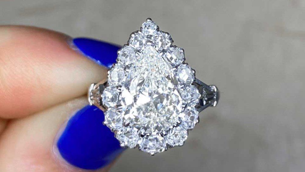 Large Pear Shaped Diamond Ring With Diamond Cluster